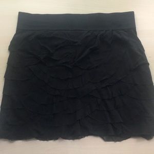 Women’s black ruffled skirt.